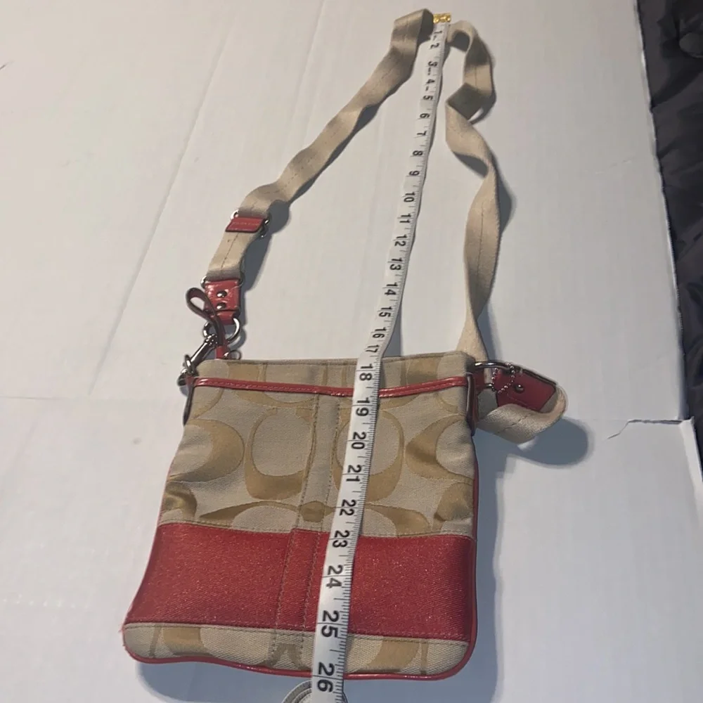 Tan and burnt orange Coach crossbody bag.